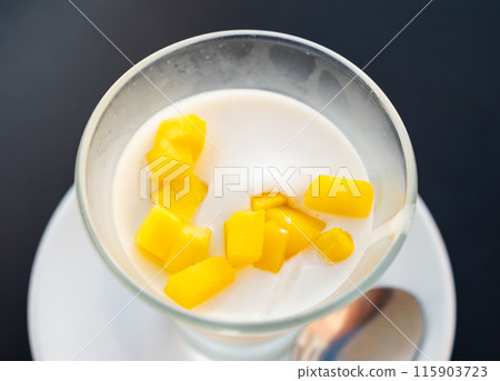 Mango mousse served in bowl for dessert 115903723
