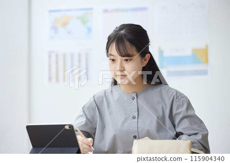 High school girls taking classes at a prep school High school girls taking classes at a prep school 115904340