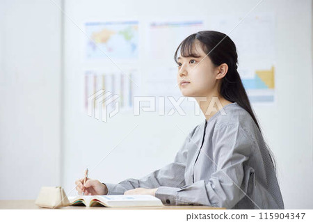 High school girls taking classes at a prep school High school girls taking classes at a prep school 115904347