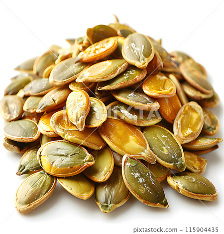 A pile of pumpkin seeds, a staple food ingredient, is displayed on a clean white background. These natural seeds can be used in various dishes and cuisines 115904435