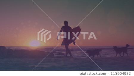 Image of glowing lights over man walking with surfboard by the sea 115904982