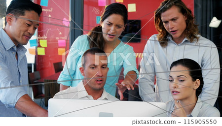 Business executives are working on computers in an office Business executives are working on computers in an office 115905550