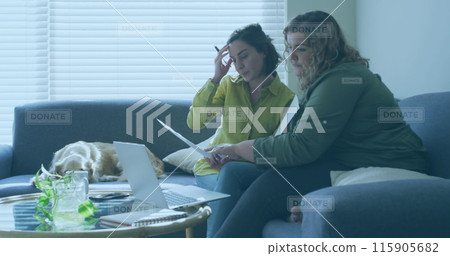 Image of donate texts over caucasian female couple using laptop 115905682
