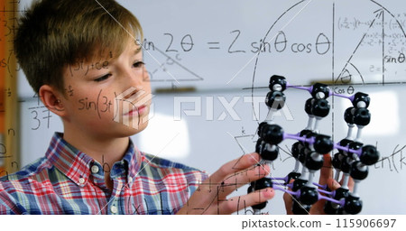 Image of mathematical formulae over smiling schoolboy Image of mathematical formulae over smiling schoolboy 115906697
