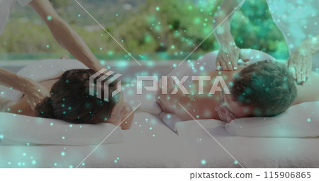 Image of light spots over caucasian couple getting massage 115906865