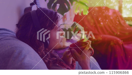 Image of light spots over biracial woman drinking coffee at home Image of light spots over biracial woman drinking coffee at home 115906866