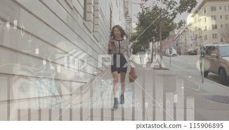 Image of financial data and graphs over biracial woman walking, using smartphone Image of financial data and graphs over biracial woman walking, using smartphone 115906895