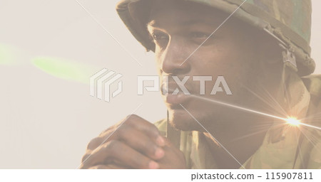 Image of light trails over african american male soldier Image of light trails over african american male soldier 115907811