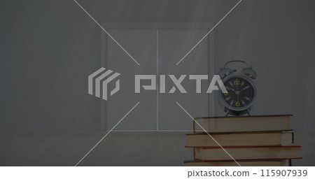 Image of alarm clock on books over table and light streaming through window 115907939