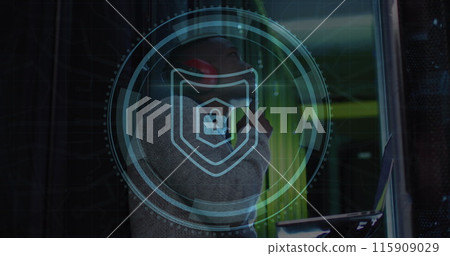 Image of cyber security text and padlock in circle, african american engineer checking data room 115909029
