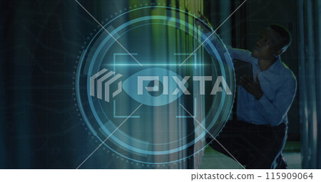 Image of eye retina scanner over african american male engineer using tablet at server room Image of eye retina scanner over african american male engineer using tablet at server room 115909064