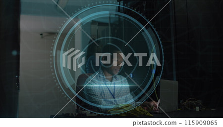 Image of eye retina scanner over african american male engineer using laptop at server room 115909065