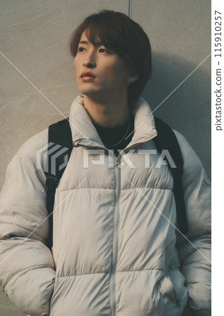 A young man with a serious look 115910257