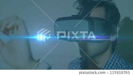 Image of blue light spot moving over caucasian man wearing vr headset 115910763
