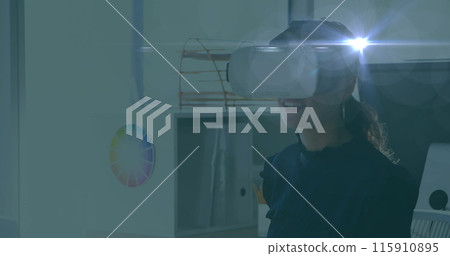 Image of bright light spot moving over caucasian woman wearing vr headset at office 115910895