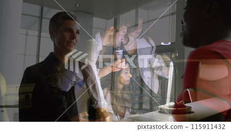 Image of caucasian businesswoman over diverse business people in office 115911432