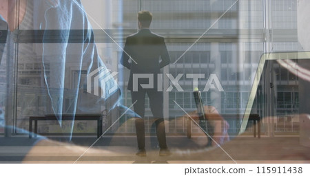 Image of caucasian businessman walking over businessman writing Image of caucasian businessman walking over businessman writing 115911438