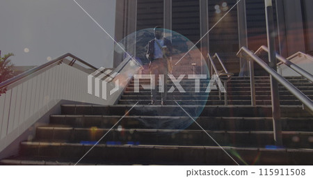 Image of stock market data processing over african american businessman walking down the stairs 115911508