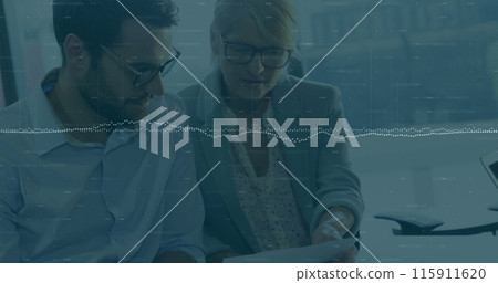 Image of data processing over two diverse businessman and businesswoman discussing at office Image of data processing over two diverse businessman and businesswoman discussing at office 115911620