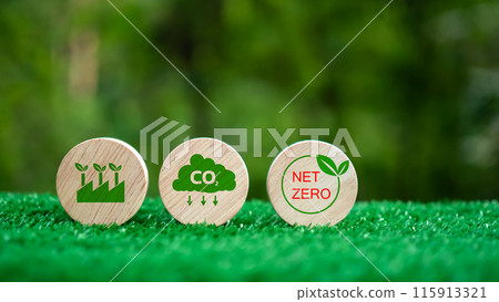 Three wooden circles with a green background and the words CO2, Net Zero. CO2 emission reduction concept, Clean environment without carbon dioxide emissions, Environmental protection concept. Three wooden circles with a green background and the words CO2, Net Zero. CO2 emission reduction concept, Clean environment without carbon dioxide emissions, Environmental protection concept. 115913321