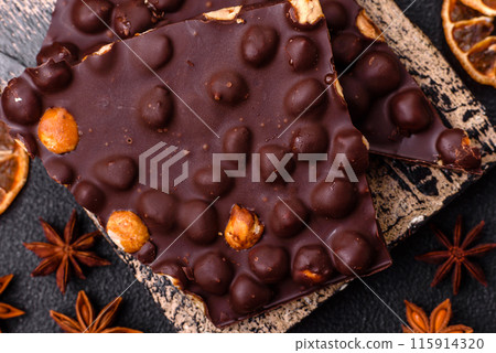 Black bitter chocolate with whole hazelnuts, candied fruits and mint 115914320