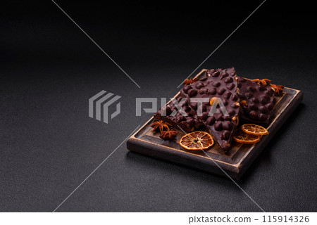 Black bitter chocolate with whole hazelnuts, candied fruits and mint 115914326