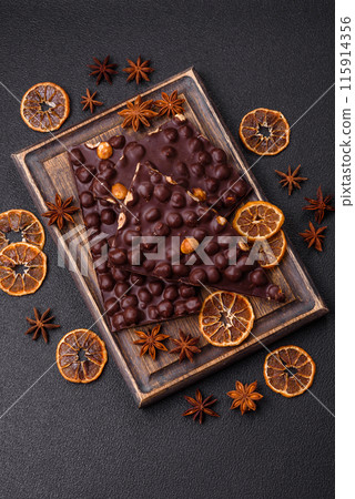 Black bitter chocolate with whole hazelnuts, candied fruits and mint Black bitter chocolate with whole hazelnuts, candied fruits and mint 115914356
