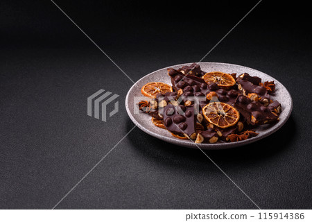 Black bitter chocolate with whole hazelnuts, candied fruits and mint 115914386