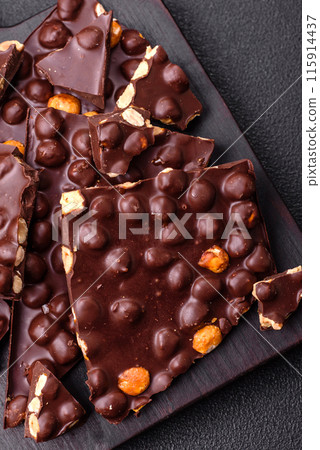Black bitter chocolate with whole hazelnuts, candied fruits and mint Black bitter chocolate with whole hazelnuts, candied fruits and mint 115914437