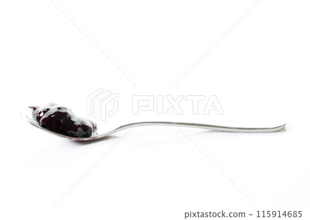 Spoon of blueberry jam on white marble table background. Selective focus. Spoon of blueberry jam on white marble table background. Selective focus. 115914685