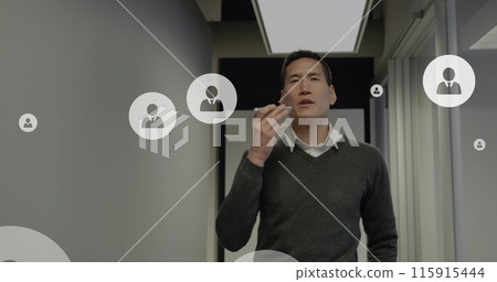 Image of social media data processing over asian businessman using smartphone Image of social media data processing over asian businessman using smartphone 115915444