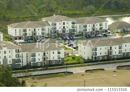 View from above of apartment residential condos in Florida suburban area. American condominiums as example of real estate development in USA suburbs 115915508