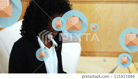 Image of letter and envelope icons in circles, african american woman working on laptop 115915886