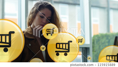 Image of shopping cart icon in circles over caucasian woman using laptop while working on laptop 115915889
