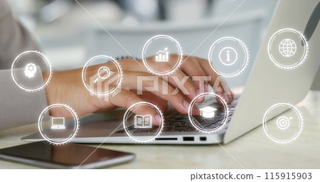 Image of digital icons over biracial businesswoman using laptop in office Image of digital icons over biracial businesswoman using laptop in office 115915903