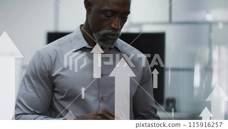Image of arrows and data processing over african american businessman in office Image of arrows and data processing over african american businessman in office 115916257