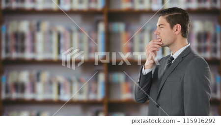Side view of a businessman using a digital screen in a library 4k Side view of a businessman using a digital screen in a library 4k 115916292
