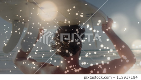 Image of lights over back view of caucasian surfer on beach Image of lights over back view of caucasian surfer on beach 115917184