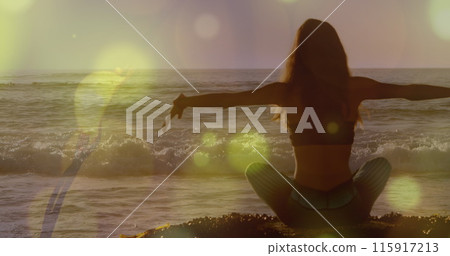 Image of lights over back view of caucasian woman practicing yoga on beach 115917213