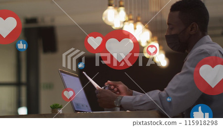 Image of floating application icons over multiracial coworkers discussing over laptop 115918298