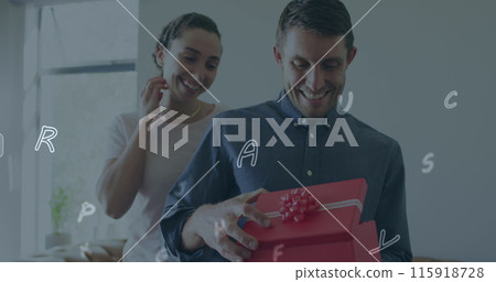 Image of social media icons over caucasian man opening a box gifted by his home at home Image of social media icons over caucasian man opening a box gifted by his home at home 115918728