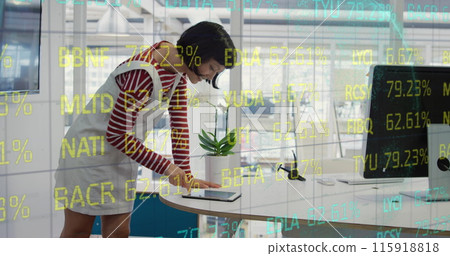 Composite of financial data processing over businesswoman using computer in office Composite of financial data processing over businesswoman using computer in office 115918818