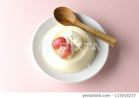 Aerial view of panna cotta with cream and grapes Aerial view of panna cotta with cream and grapes 115919237
