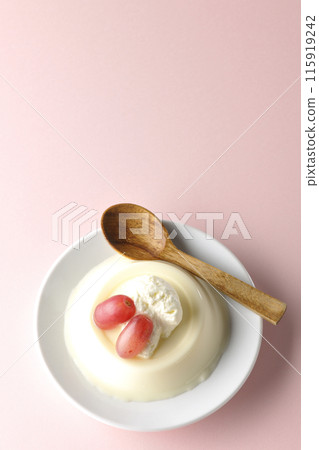Aerial view of panna cotta with cream and grapes Aerial view of panna cotta with cream and grapes 115919242