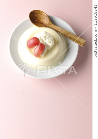 Aerial view of panna cotta with cream and grapes Aerial view of panna cotta with cream and grapes 115919243