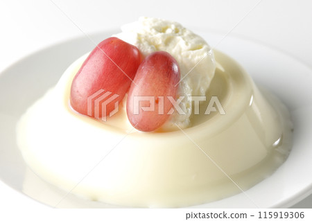 Panna cotta with cream and grapes photographed on a white background Panna cotta with cream and grapes photographed on a white background 115919306