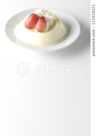 Panna cotta with cream and grapes photographed on a white background 115919321