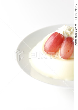Panna cotta with cream and grapes photographed on a white background Panna cotta with cream and grapes photographed on a white background 115919337