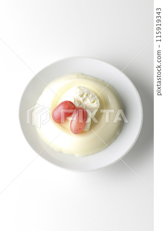 Panna cotta with cream and grapes photographed on a white background 115919343