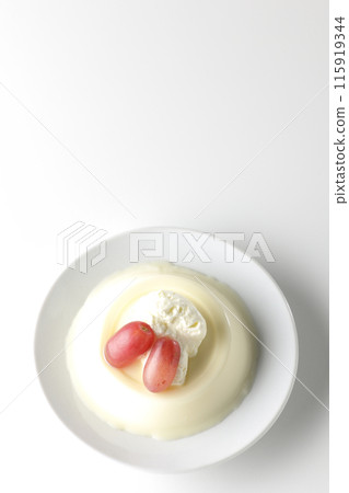 Panna cotta with cream and grapes photographed on a white background 115919344
